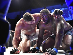 Alistair Overeem (left) consoles Walt Harris after their heavyweight bout during UFC Fight Night on Saturday.