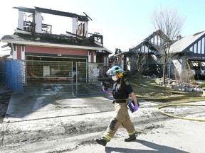 Calgary Firefighters investigate an overnight fire on Saturday, May 2, 2020 in the northwest community of Royal Oak. No one was injured, but at least four homes were damaged.