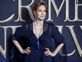 In this file photo taken on November 13, 2018 British author and screenwriter J.K. Rowling poses upon arrival to attend the UK premiere of the film 'Fantastic Beasts: The Crimes of Grindelwald' in London.