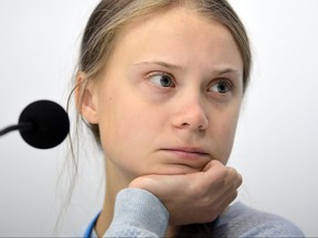 In this file photo taken on Dec. 9, 2019, Swedish climate activist Greta Thunberg holds a press conference with other young activists to discuss the ongoing UN Climate Change Conference COP25 at the 'IFEMA - Feria de Madrid' exhibition centre, in Madrid.