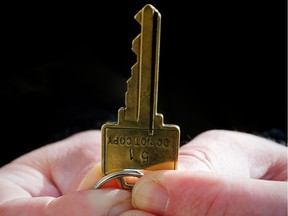 A man holds a key to home
