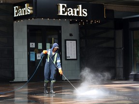 Stephen Avenue Mall in front of the Earls restaurant gets a high pressure wash on Sunday, May 24, 2020. Calgary is set to allow more reopening tomorrow with hair stylists, barbers and sit down restaurants allowed to reopen with COVID-19 precautions.