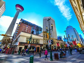 Pedestrians walking past retail outlets along Stephen Ave in Autumn, Calgary, Alberta. Stephen Ave is a famous pedestrian mall in downtown Calgary