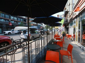 A normally bustling outdoor patio at the Coop on 17 Ave SW was abnormally quiet during the lunch hour in Calgary Friday, August 10, 2018.