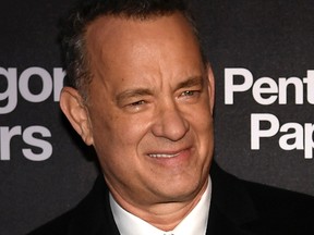 Tom Hanks attends the premiere of "The Post" on Jan. 13, 2018, in Paris. "The Post," which came out in theaters in the United States on January 12, recounts the nail-biting behind-the-scenes story of the 1971 publication by The Washington Post of the Pentagon Papers, which exposed the lies behind US involvement in the Vietnam War. / AFP PHOTO / Philippe LOPEZ (Photo credit should read /)