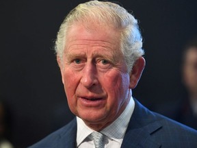 Prince Charles looks on during a visit to the London Transport Museum, in London, March 4, 2020.