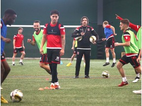 Cavalry FC coach/ GM Tommy Wheeldon Jr (C) oversees a drill during the first day of training camp for the CPL team at the Macron Performance Centre in Calgary on Monday, March 2, 2020. Jim Wells/Postmedia