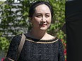 Meng Wanzhou, CFO of Huawei, walks down her driveway to her car as she departs her home for BC Supreme Court on May 27, 2020 in Vancouver.