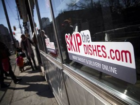Alberta's restaurant industry wants the province to impose a cap on fees charged by Skip the Dishes, Uber Eats and other food delivery apps.