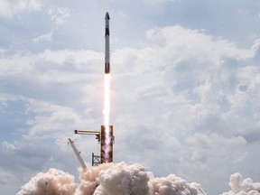 The SpaceX Falcon 9 rocket with the manned Crew Dragon spacecraft attached takes off from launch pad 39A at the Kennedy Space Center in Cape Canaveral, Fla., Saturday, May 30, 2020.