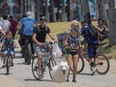 Holiday beachgoers head to Venice Beach on Memorial Day as coronavirus safety restrictions continue being relaxed in Los Angeles County and nationwide, in Los Angeles, Sunday, May 24, 2020.