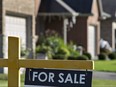 A "for sale" sign is posted outside a home in this file photo.