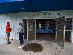 Alex, left, and Abi Dalgleish, lifeguards at Silver Spring pool, mark the walls to facilitate physical distancing on Monday, June 29, 2020. Silver Spring pool will be open to the public while implementing cautionary measures in mid-July.