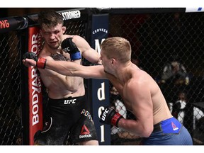 Austin Hubbard punches Max Rohskopf in their lightweight bout during the UFC Fight Night event at UFC APEX on June 20, 2020 in Las Vegas. Chris Unger/Zuffa LLC via Getty Images