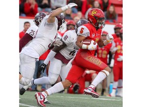 Dinos receiver Jalen Philpot carries the ball during the second half of action of the 2019 Mitchell Bowl Calgary Dinos beat the McMaster Marauders 30-17 at home from McMahon Stadium on Saturday, November 16, 2019. Brendan Miller/Postmedia