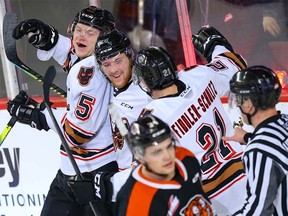 Calgary Hitmen Jonas Peterek celebrates with teammates after his goal against the Medicine Hat Tigers during WHL hockey in Calgary on Wednesday January 1, 2020.