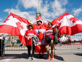 Andrew Larche poses for photos during Canada Day festivities on Parliament Hill in Ottawa, July 1, 2019.