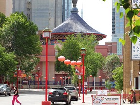 A woman walks past The Calgary Chinese Cultural Centre in Chinatown. Monday, June 22, 2020.