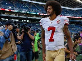 Quarterback Colin Kaepernick of the San Francisco 49ers walks off at CenturyLink Field on September 25, 2016 in Seattle.