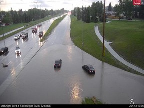 An image from the city of Calgary's traffic camera system shows flooding at McKnight Blvd. and 52 St. N.E. after a hailstorm struck on Saturday, June 13, 2020. City of Calgary image