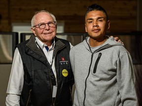 Jim Moore, Calgary Dream Centre CEO and executive director, and Lansin Goodrunning a resident at the centre.