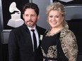 Kelly Clarkson and Brandon Blackstock arrive for the 60th Grammy Awards on Jan. 28, 2018, in New York.