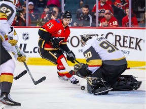 Mar 8, 2020; Calgary, Alberta, CAN; Vegas Golden Knights goaltender Robin Lehner (90) makes a save as Calgary Flames center Mikael Backlund (11) tries to score during the third period at Scotiabank Saddledome. Mandatory Credit: Sergei Belski-USA TODAY Sports ORG XMIT: USATSI-406054