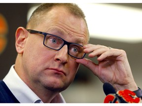 Flames General Manager, Brad Treliving speaks to media on the stoppage of the NHL and the death of Ken King at the Scotiabank Saddledome in Calgary on Thursday, March 12, 2020. Darren Makowichuk/Postmedia