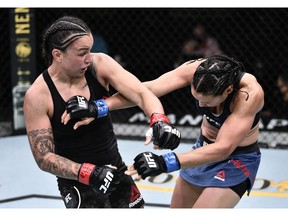 Raquel Pennington punches Marion Reneau in their bantamweight bout during UFC Fight Night at UFC APEX in Las Vegas on Saturday, June 20, 2020. Chris Unger/Zuffa LLC via USA TODAY Sports