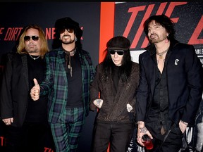 (L-R) Vince Neil, Nikki Sixx, Mick Mars and Tommy Lee of Motley Crue arrive at the premiere of Netflix's "The Dirt" at ArcLight Hollywood on March 18, 2019, in Hollywood, Calif.