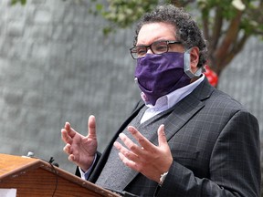 A masked Mayor Naheed Nenshi speaks at the Whitehorn Community Centre on June 11, 2020.
