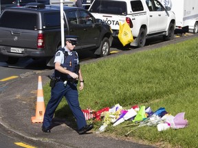 Fellow officers and members of the local community placed flowers near the scene on Reynella Drive where Constable Matthew Hunt was killed June 20, 2020 in Auckland, New Zealand.