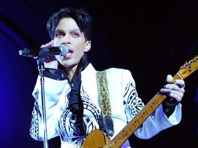 In this file photo taken Oct. 11, 2009, Prince performs at the Grand Palais in Paris.