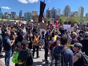 Anti-racism protesters gather near the 10th Street N.W. bridge at Kensington on Wednesday, June 3, 2020.