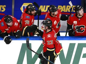 The Calgary Flames’ Sean Monahan celebrates with teammates after Elias Lindholm scored a goal on Edmonton Oilers’ Mike Smith in an NHL exhibition game at Rogers Place in Edmonton on July 28, 2020. Jeff Vinnick/Getty Images
