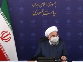 A handout picture provided by the Iranian Presidency on July 18, 2020, shows President Hassan Rouhani listening during a meeting of the national taskforce to combat the COVID-19 pandemic, in the capital Tehran.