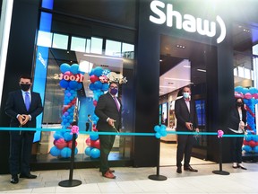 From left; Shaw Communications President Paul McAleese, Calgary Mayor Naheed Nenshi, Shaw Communications Executive Chair and CEO Brad Shaw and Tanya Fir, Alberta Minister of Economic Development, Trade and Tourism cut a ribbon at the official launch of Shaw Mobile at Market Mall on Thursday, July 30, 2020.