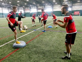 Cavalry FC returning players Nik Ledgerwood (L) and Sergio Camargo exercise during the first day of training camp for the CPL team at the Macron Performance Centre in Calgary on Monday, March 2, 2020. Jim Wells/Postmedia