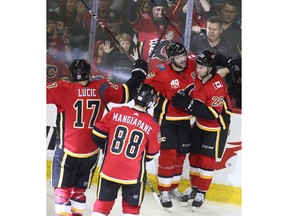 Dillon Dube celebrates a goal with teammates as the Calgary Flames battle the Vegas Golden Knights at Scotiabank Saddledome on March 8, 2020. Jim Wells/Postmedia