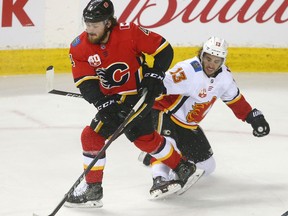 Johnny Gaudreau tries to slow Rasmus Andersson during a Calgary Flames intrasquad game at the Saddledome in sson Calgary on Tuesday, July 21, 2020. Jim Wells/Postmedia