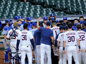 Members of the Dodgers and Astros benches converge after a strikeout to end the sixth inning at Minute Maid Park in Houston, Tuesday, July 28, 2020.