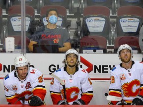 Calgary Flames Sean Monahan, Johnny Gaudreau and Elias Lindholm on the bench during a intra-squad game at the Saddledome in Calgary on Sunday July 19, 2020. The Flames Will take on Winnipeg Jets in 2020 Stanley Cup Playoffs starting August 1st. Al Charest / Postmedia