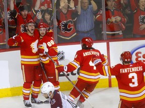 The Calgary Flames’ Andrew Mangiapane (88) celebrates with teammates after scoring the opening goal against the Colorado Avalanche in Game 1 of their first-round NHL playoff series at Scotiabank Saddledome in Calgary on Thursday, April 11, 2019. Darren Makowichuk/Postmedia