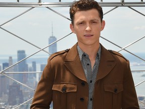 Actor Tom Holland of "Spider-Man: Far From Home" participates in the ceremonial lighting of the Empire State Building on June 24, 2019 in New York City.