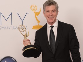 Reality show host Tom Bergeron poses in the press room at the 64th annual Prime Time Emmy Awards at the Nokia Theatre at LA Live in Los Angeles, Calif., Sept. 23, 2012.