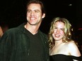 Jim Carrey arrives to the premiere of "Man on the Moon with his companion, actress Renee Zellweger, in Hollywood, Calif., Dec. 20, 1999.