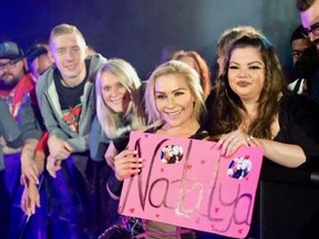 Natalya Neidhart interacting with fans during a WWE live event.