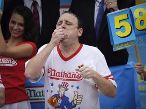 Joey Chestnut competes in the 98th annual Nathan's Famous Hot Dog Eating Contest at Coney Island on July 4, 2014 in New York City. Chesnut is a 12-time champion at the event.
