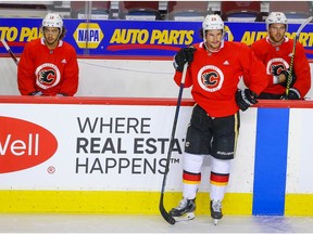 Calgary Flames Johnny Gaudreau (L) is back skating with Sean Monahan and Elias Lindholm for the first time since NHL training camp returned after the COVID-19 lock down. The Flames will take on Winnipeg Jets in 2020 Stanley Cup Playoffs starting August 1st. Al Charest / Postmedia