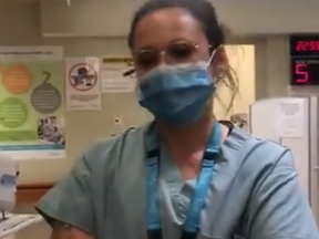 An employee at St. Joseph's Health Centre Toronto addresses Letitia Montana over her refusal to wear a mask in order to receive treatment.